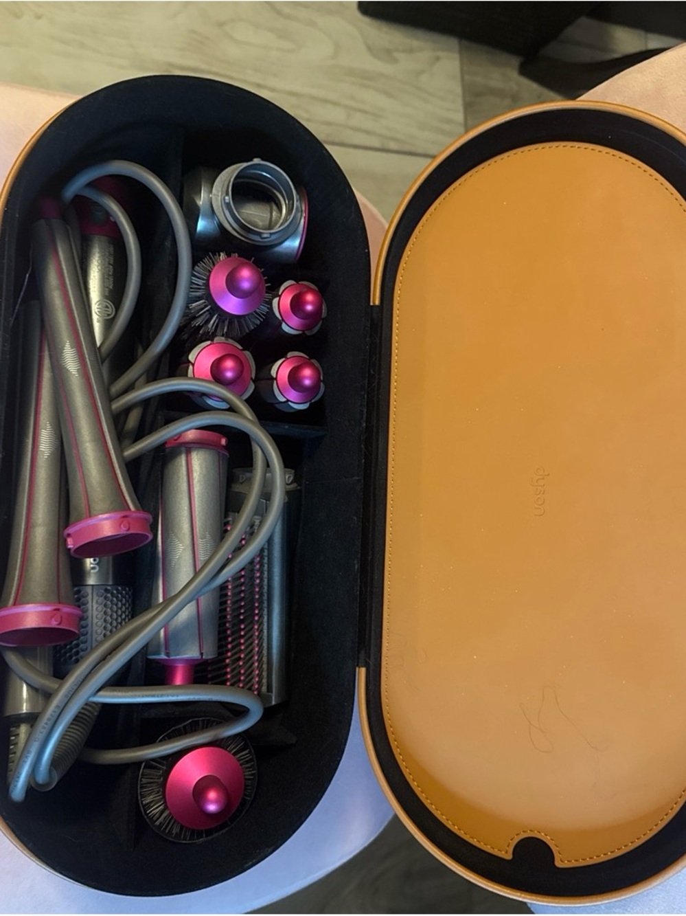 Dyson styling set with metallic gray and magenta accents